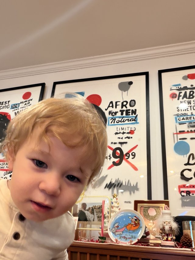Curious Toddler with Blonde Hair at Home
