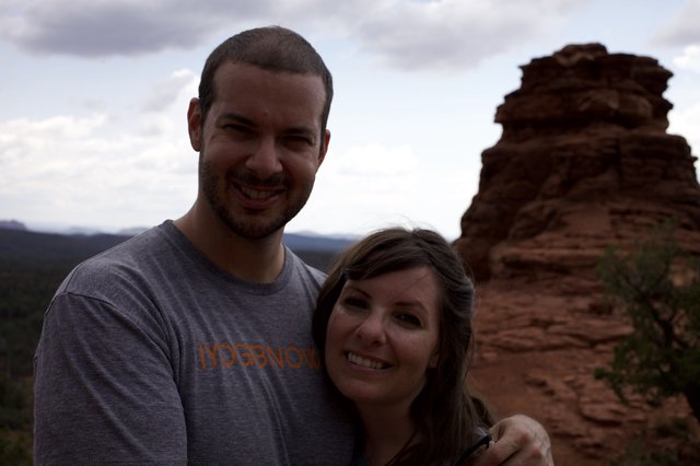 Couple Smiling Atop Sedona's Red Rock Formations