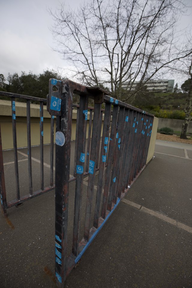 Weathered Metal Gate with Peeling Blue Paint