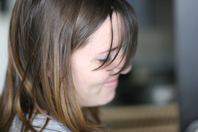Windswept Hair Frames a Quiet Moment of Reflection