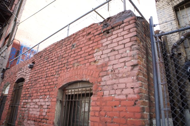 Brick Building with Fence and Gate
