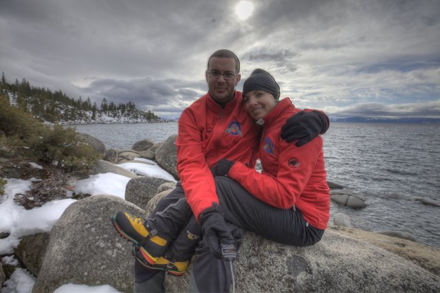 Couple Embracing at Snowy Lake Tahoe Shore