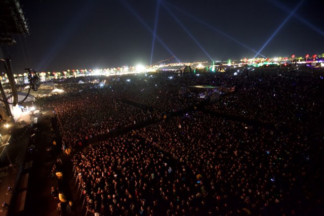 Night Sky Illuminated by Concert Crowd