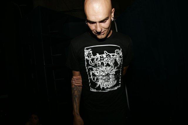Bald man with tattoo and black T-shirt