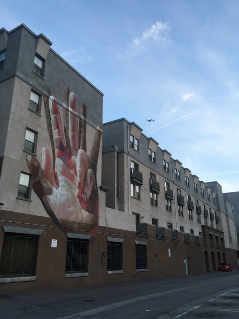 The Hand of Art: A Mural on a Building in Los Angeles