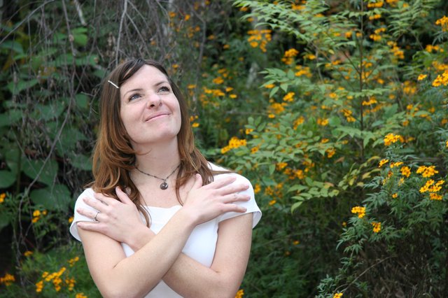 Dreaming Woman Among Golden Wildflowers in Nature