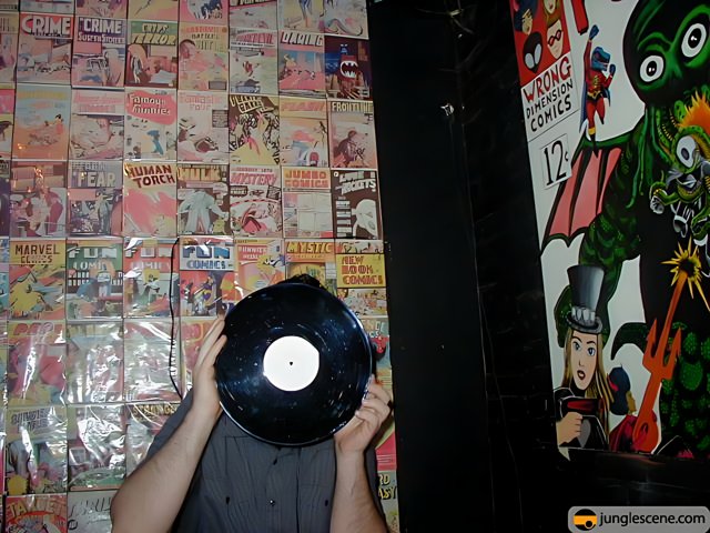 Record Enthusiast Surrounded by Comics