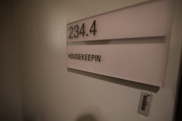 Housekeeping Room 234.4 Sign in Hotel Corridor