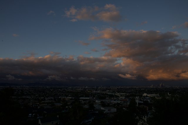 City at Sunset under Cumulus Clouds