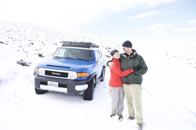Couple Embracing in Snowy Mountain Landscape