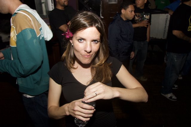 Woman With Flower in Hair at Nightclub Party