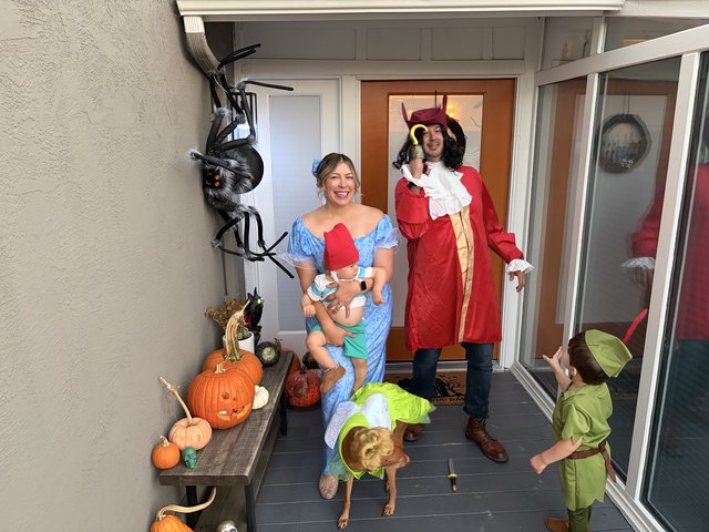 Family Peter Pan Halloween Costumes on Front Porch