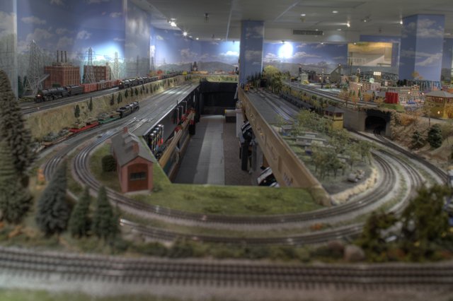 Miniature Train Journey through a Cityscape