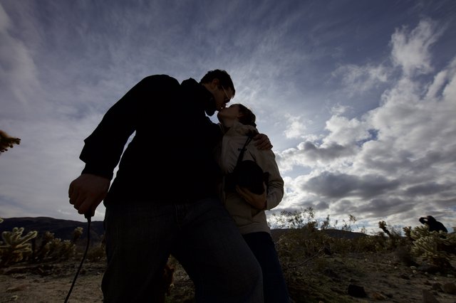 Desert Kiss Under Dramatic Cloudy Sky