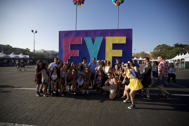 Group photo in front of the FYF sign