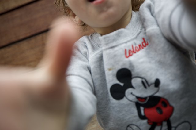 Child in Mickey Mouse Sweatshirt with Personalized Name
