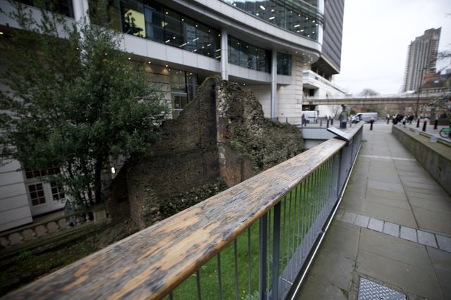 Ancient Roman Wall Ruins Amid Modern London Architecture