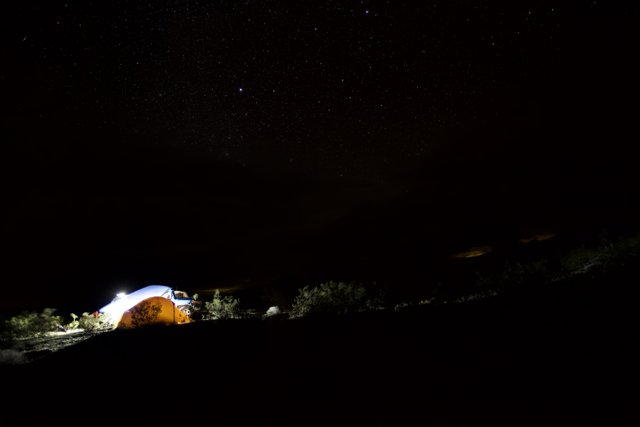 Mountain Tent Glowing Under the Night Sky