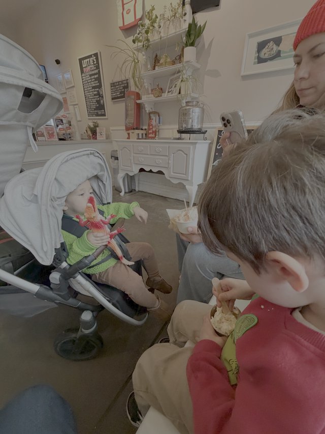 Mother and Children Enjoying Cozy Cafe Time