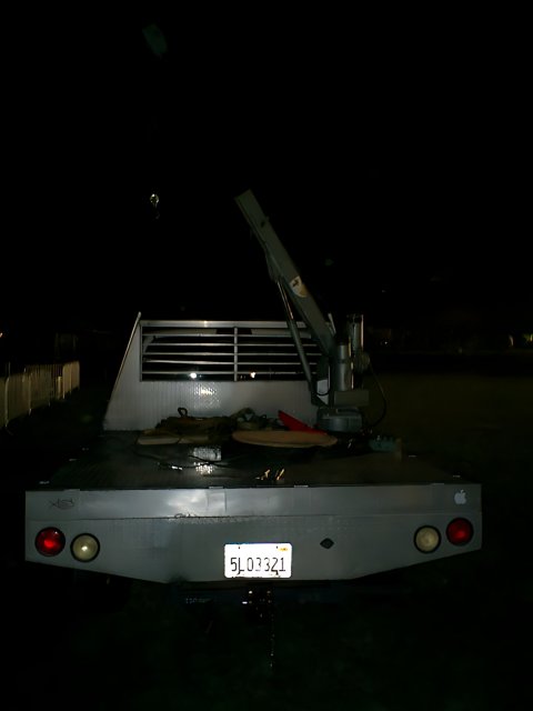 Tow truck with crane at night