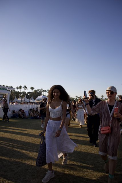 Elegance in Motion: A Fashionable Sunset Stroll at Coachella 2024
