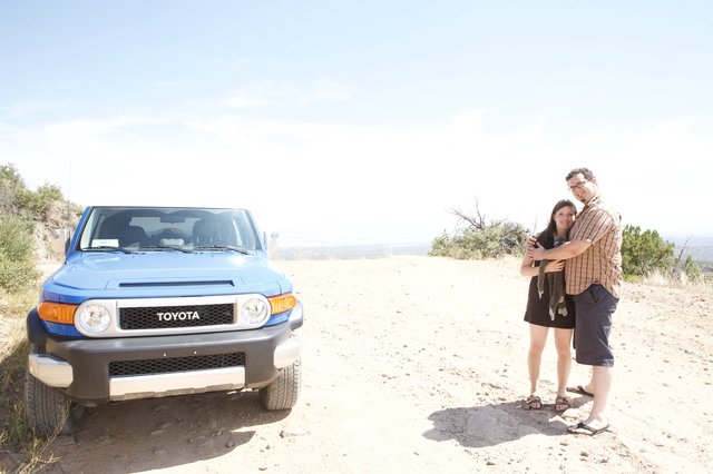 Couple Poses with Toyota FJ Cruiser in Desert