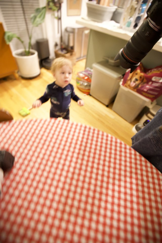 Toddler's Curious Gaze from Kitchen on Christmas Morning