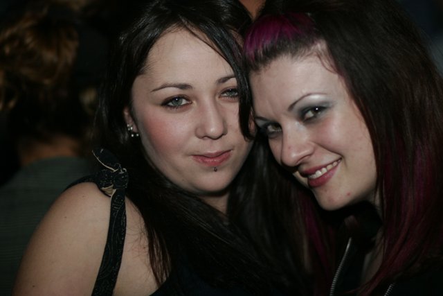 Two Women Enjoying Nightlife at Urban Party