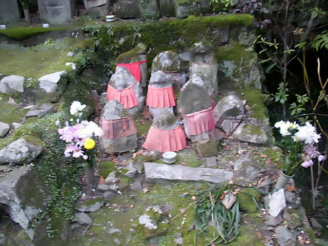 Serene Statues Amidst Blooming Beauty