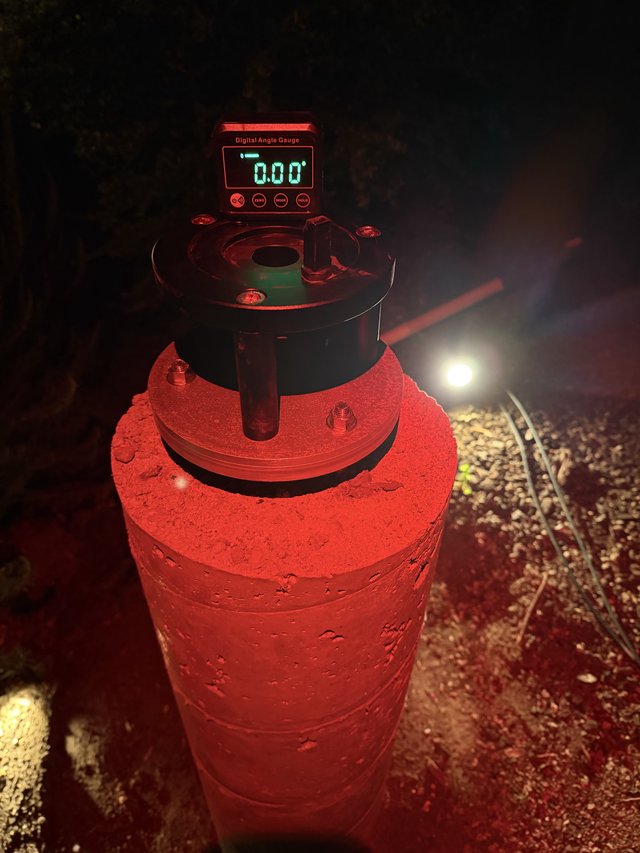 Digital Angle Gauge on Concrete Pier at Night
