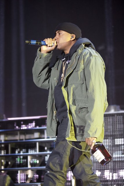 Nas Takes the Stage in Green Jacket and Black Hat