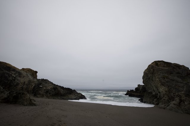 Moody Coastal Cove Between Ancient Sea Rocks