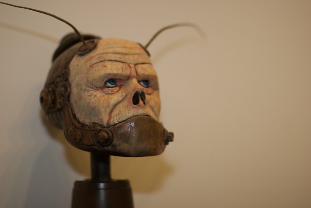 Creepy Bronze Mask Figurine