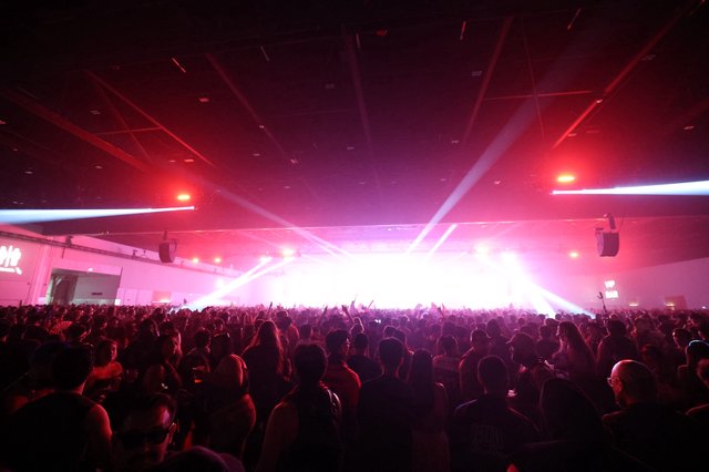 Massive Crowd Surges Toward Blazing Stage Lights