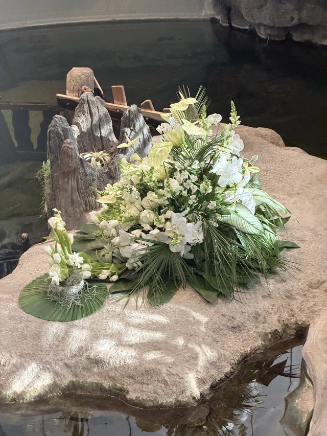 Memorial Floral Arrangement on Rocky Water Feature