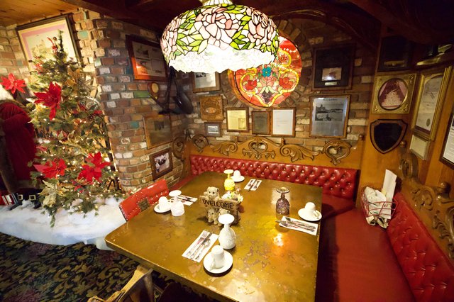 Cozy Christmas Corner with Tiffany Lamp and Red Leather Booth