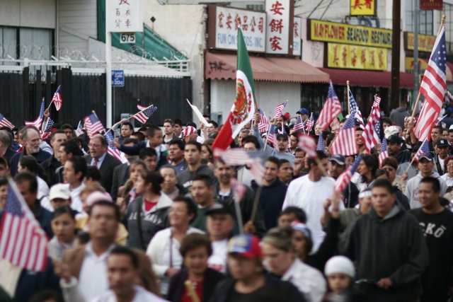 Patriotic Crowd Holds American Flags in the Street