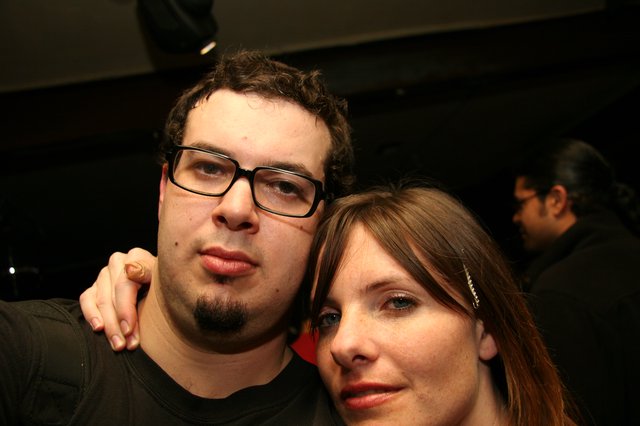 Couple Posing Together at Nighttime Social Event
