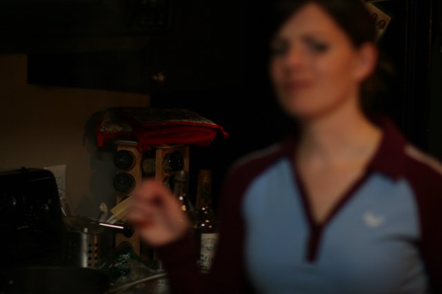 Barmaid in Blue Jersey Behind the Bar