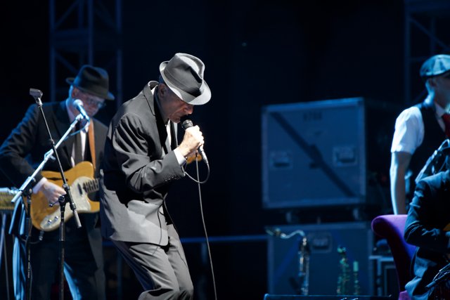 Leonard Cohen Takes the Stage in Fedora and Suit