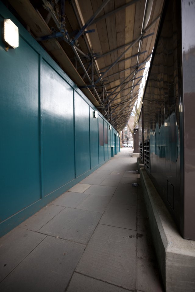 Empty Covered Walkway with Turquoise Walls in London