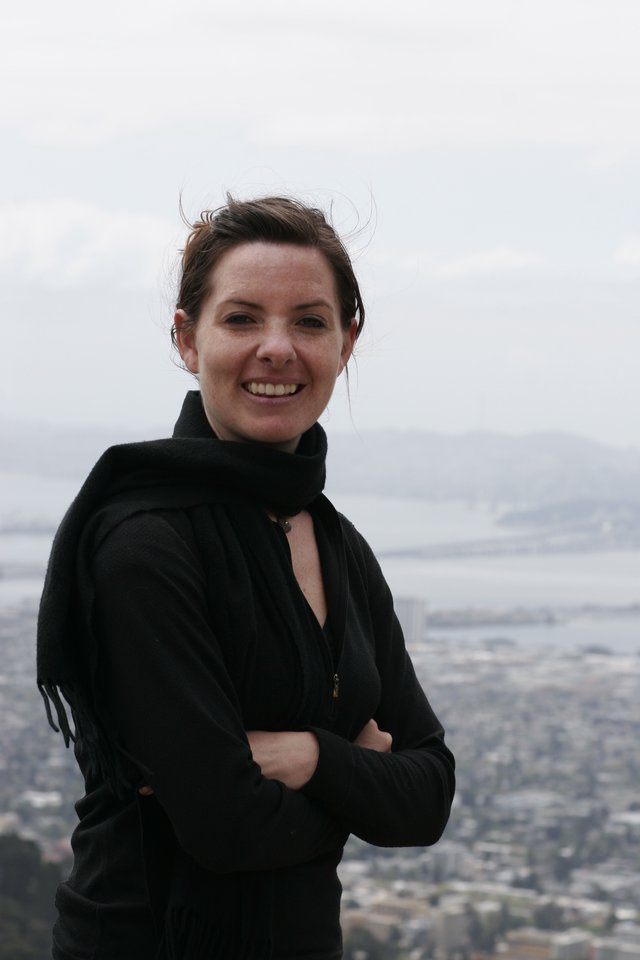 Woman Smiling Atop San Francisco Overlook