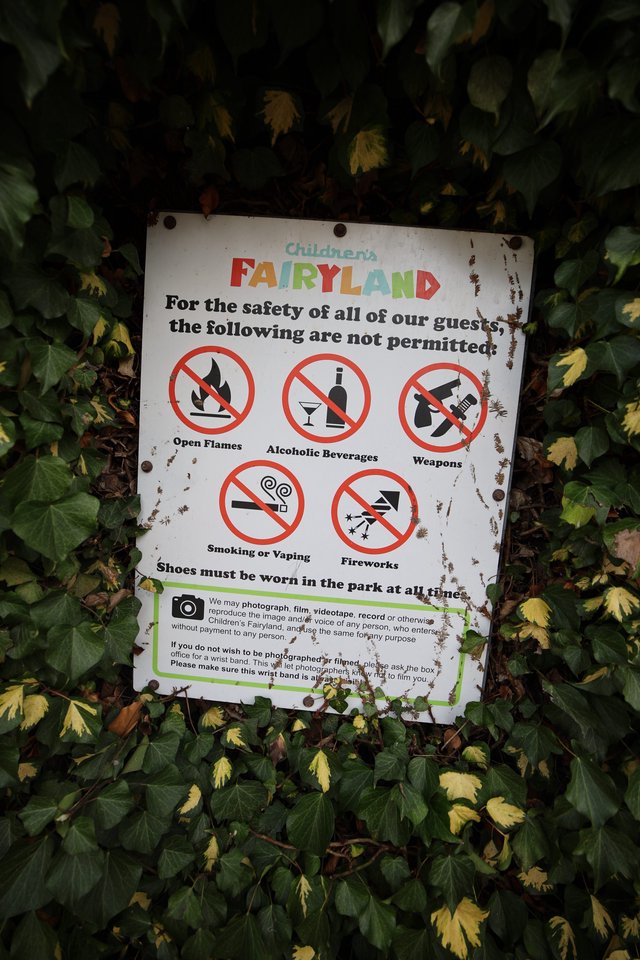 Children's Fairyland Safety Rules Sign Among Ivy