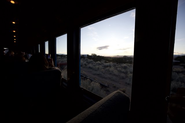 Desert Twilight Through Train Windows at Dusk