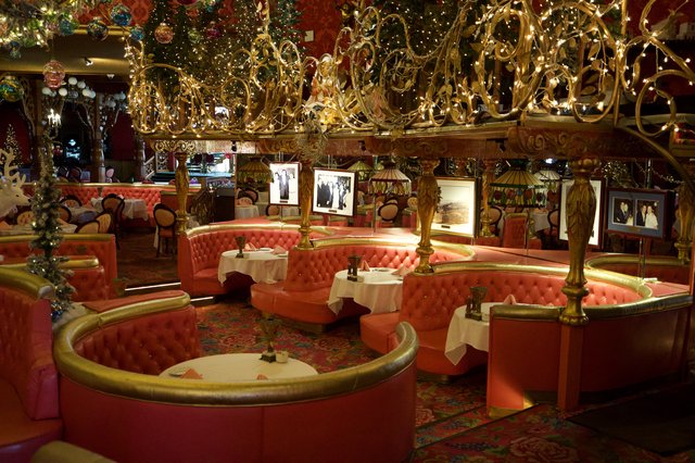 Opulent Holiday-Decorated Restaurant with Circular Booth Seating