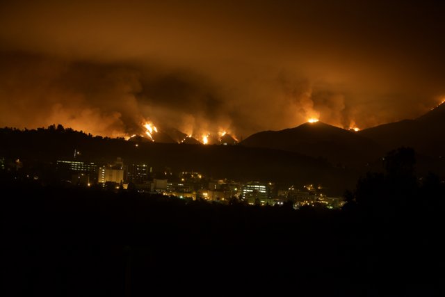 Flames Engulf the Land and Cityscape