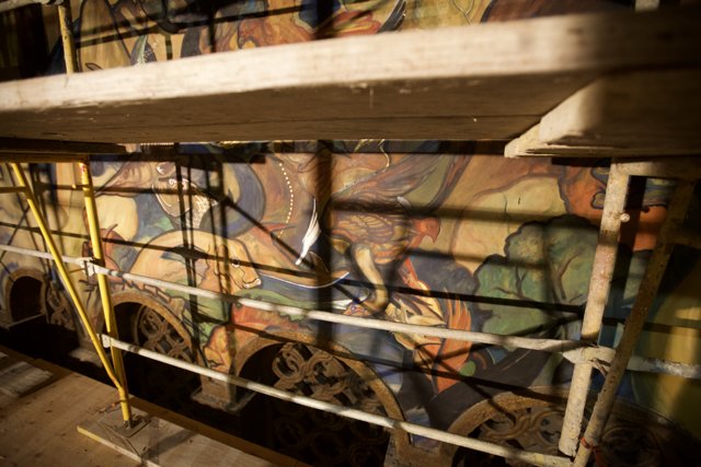 Handrails and Plywood Frame a Stunning Mural