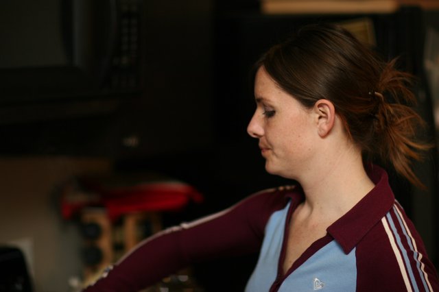 Woman in Profile at Indoor Gathering, 2006