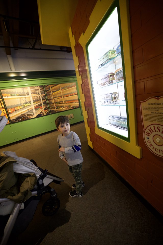 Young Boy Exploring Train Museum Display
