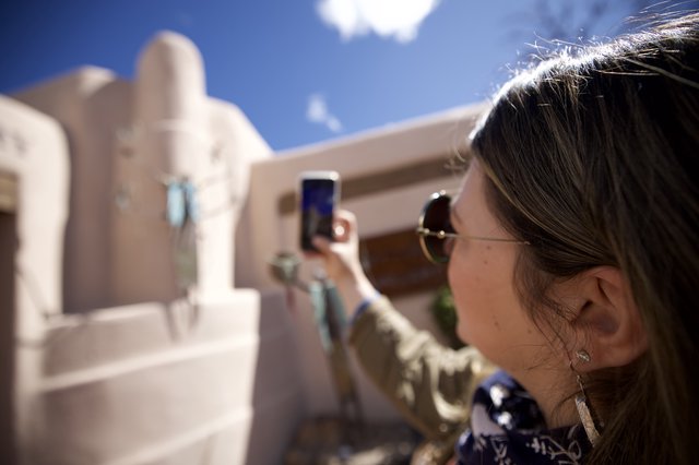 Tourist Photographing Adobe Architecture in Santa Fe